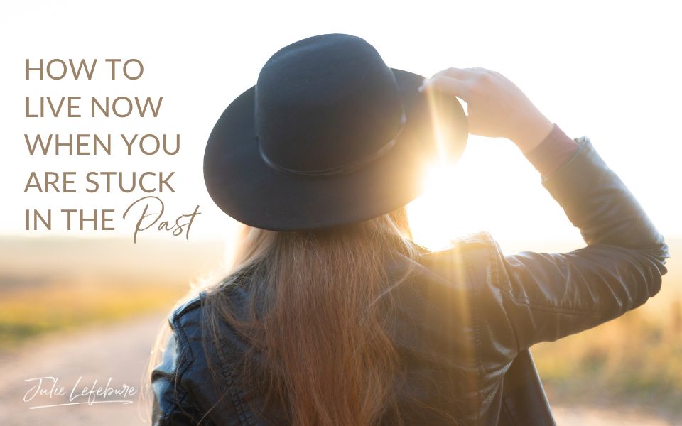 How to Live Now When You Are Stuck in the Past | woman facing away wearing black wide-brimmed hat looking far off